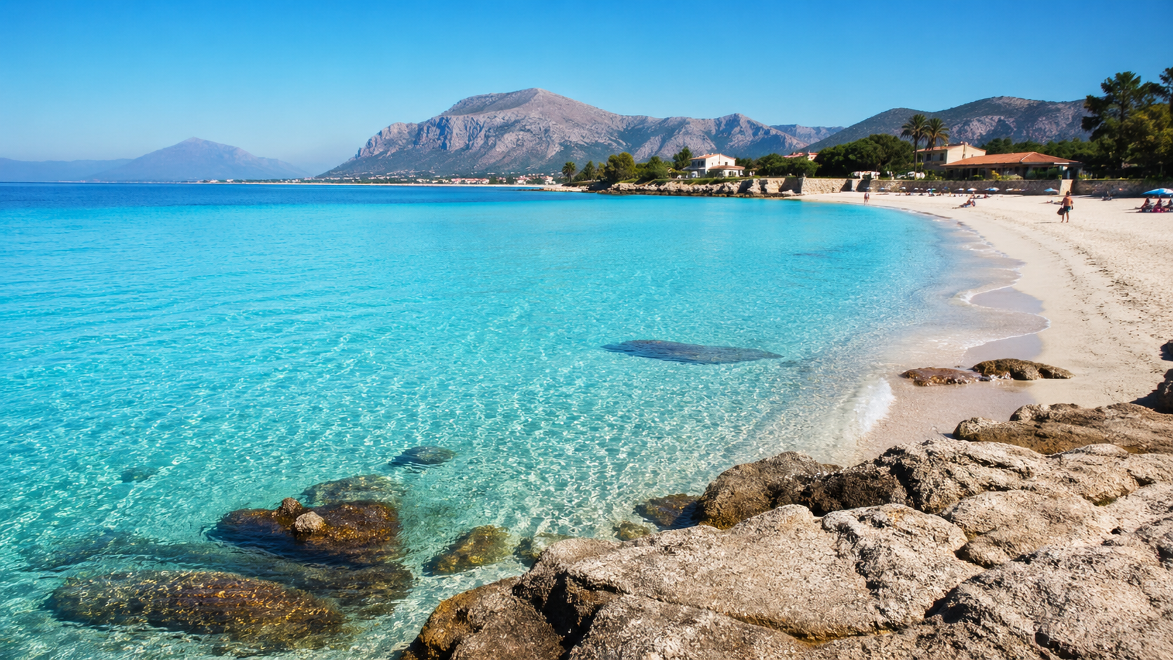 Coastal Serenity And Mountain Backdrop